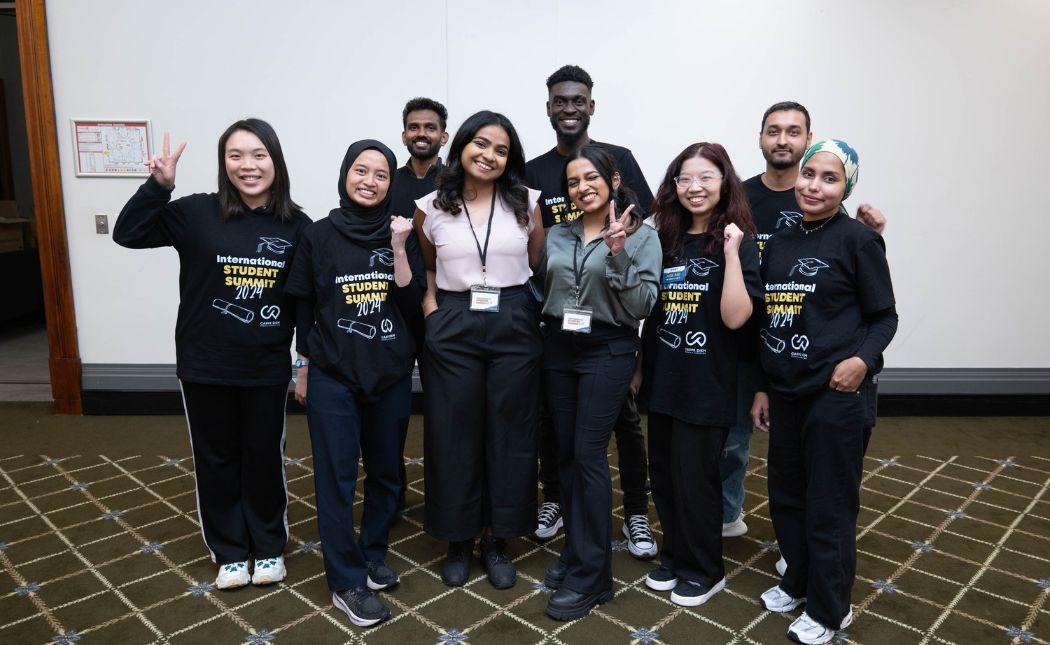 International Student Summit volunteers smiling at a previous event
